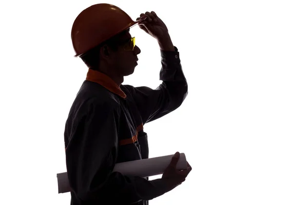 손에 프로젝트와 건설 노동자의 실루엣 프로필, 흰색 고립 된 배경에 바지에 남자, 중공업의 개념 — 스톡 사진