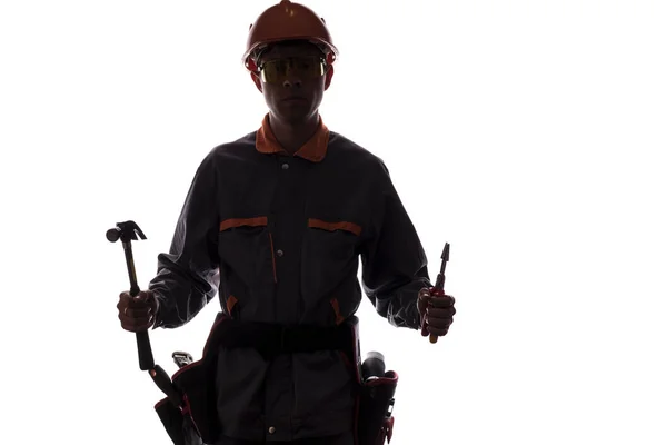 Silhouette of construction worker with professional tools, man i — Stock Photo, Image