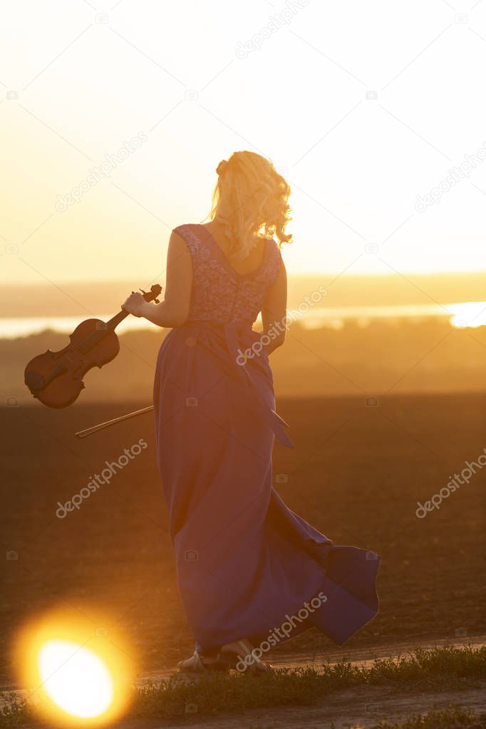silhouette of a female figure in field with violin at sunset, woman relaxing on nature, concept art and hobby