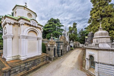 Milan, Italy - December 2017: Family crypts at the Monumental city cemetery clipart
