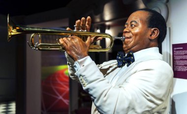 Prague, Czech republic - December 2018: Louis Armstrong wax figure in Madame Tussauds museum clipart