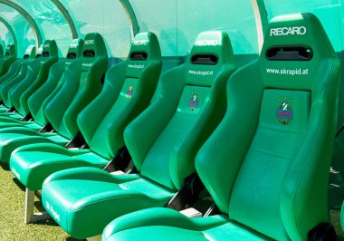Green comfy seats at the team staff bench at FC Rapid stadium, Vienna, Austria