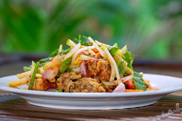 Spicy Mango Salad with Soft Shell Crab - Popular Thai Food in Thailand