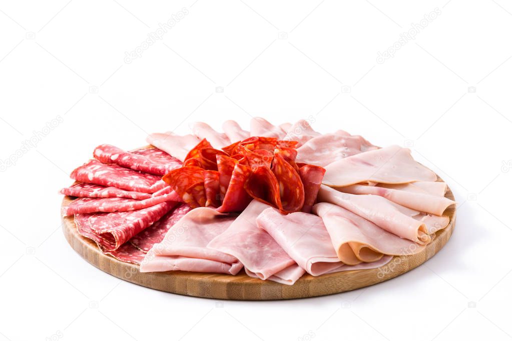 Cold meat on cutting board isolated on white background. Ham, salami, sausage mortadella and turkey