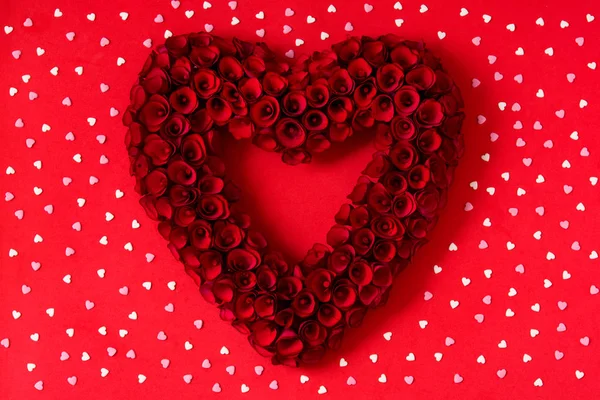 Heart Made Red Roses Heart Candies Red Background Valentine Day — стоковое фото