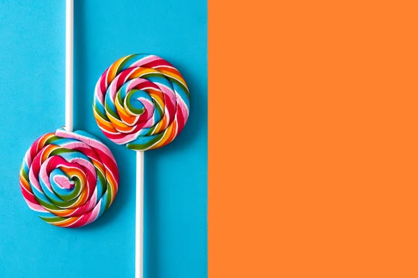 Colorful Lollipops Blue Orange Background Copyspace — Stock Photo, Image