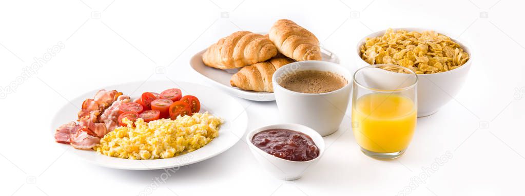 Breakfast with scrambled eggs, bacon, tomatoes,coffee,orange juice ,croissant and corn flakes isolated on white background. Panoramic view