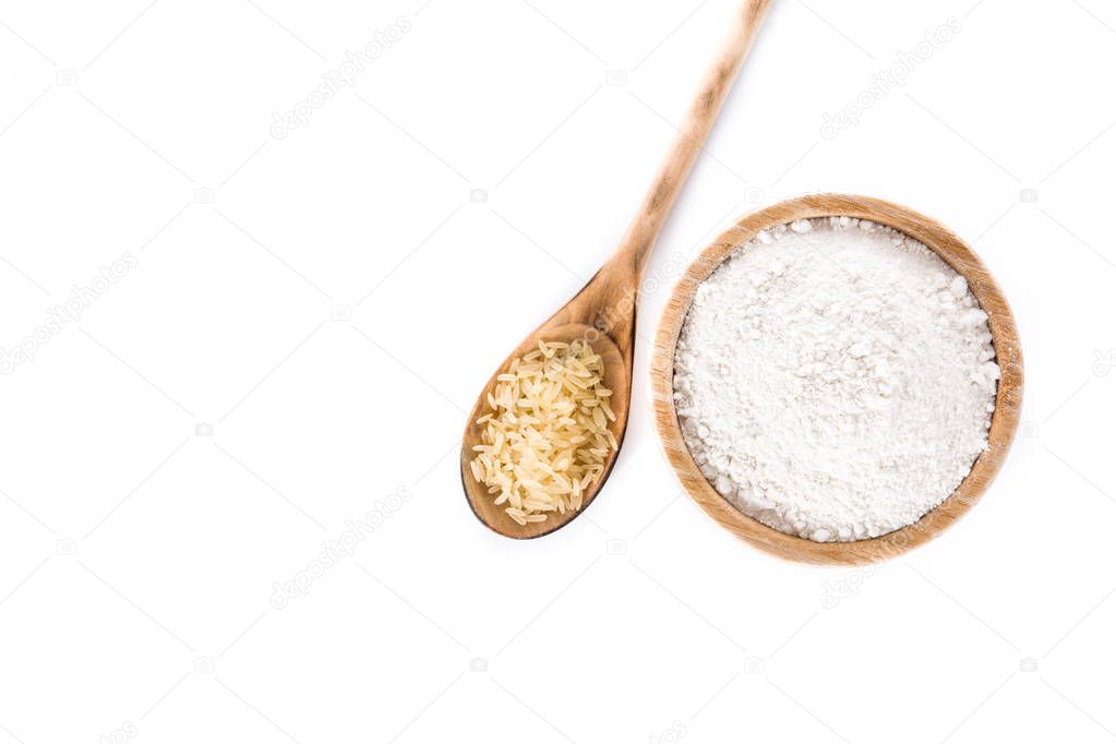 White rice flour in a bowl isolated on white background. Top view. Copyspace