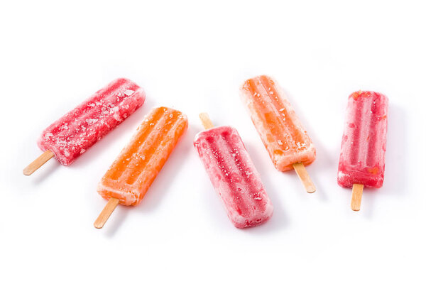 Orange and strawberry popsicles isolated on white background. 