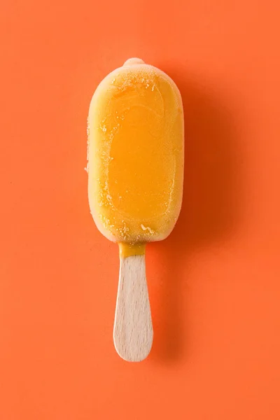 Ghiacciolo Arancione Sfondo Arancione Vista Dall Alto — Foto Stock