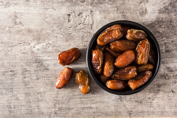 Dates Black Bowl Wooden Table Top View Copyspace — Stock Photo, Image