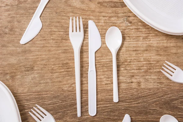 Disposable Plastic Cutlery Wooden Table Top View — Stock Photo, Image