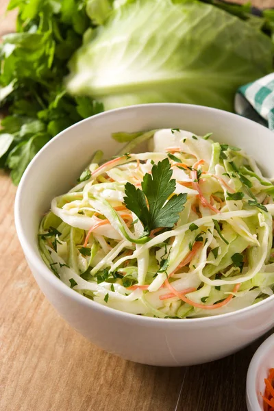 Coleslaw salad in white bowl