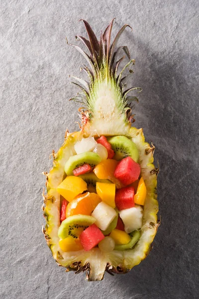 Mix fruit served inside pineapple
