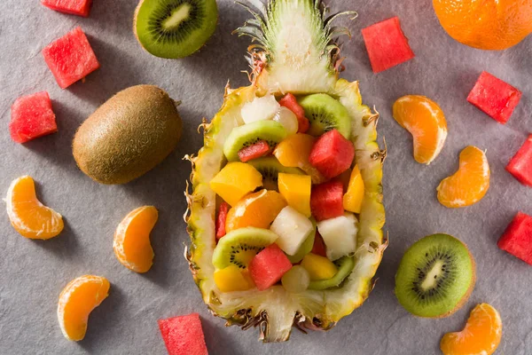 Mix fruit served inside pineapple