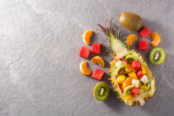 Mix fruit served inside pineapple