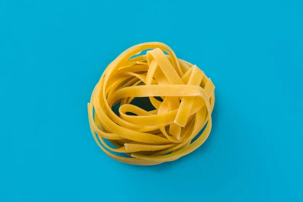 Capellini Pasta Blue Background — Stock Photo, Image