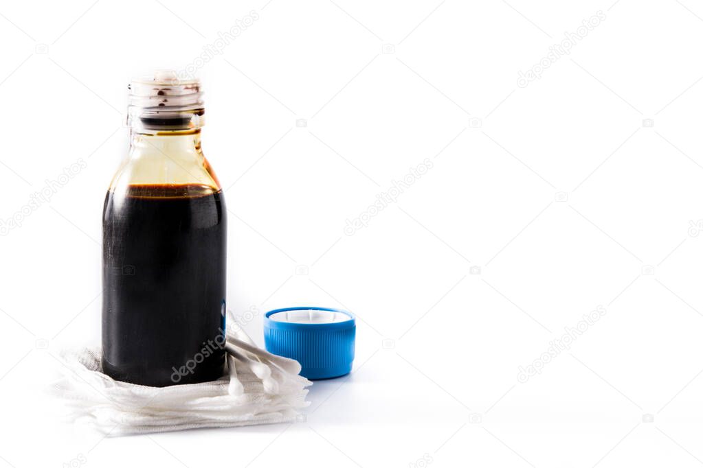 Medical iodine in a bottle and gauzes isolated on white background. Copy space