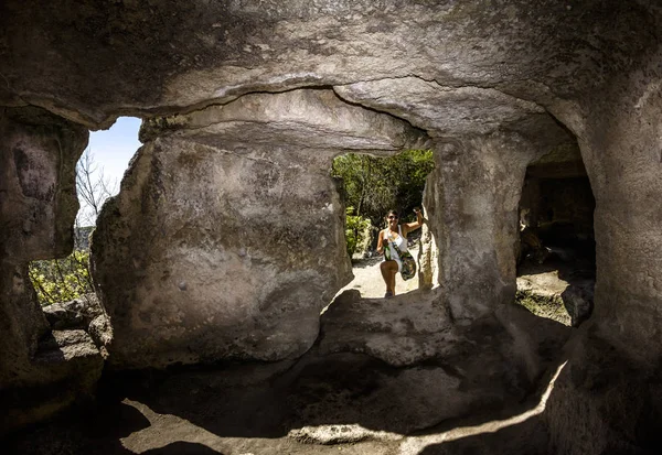 Bakhchisaray. Crimea.August 30, 2011.Girl posing against the backdrop of the caves the cave city Chufut-Kale, Crimea.Ukraine.