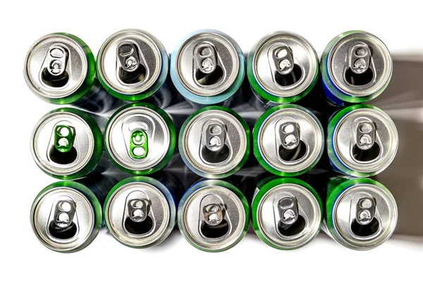 Aluminum cans of beer stand in rows on a light background — Stock Photo, Image