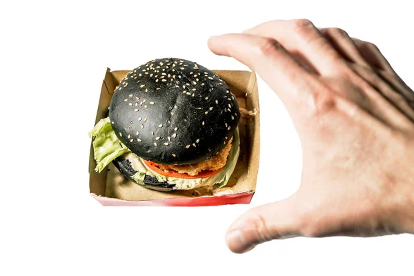 Man Hand Reaches Black Burger White Background — Stock Photo, Image