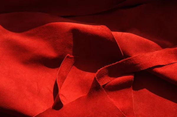 Dark red matte background of suede fabric, closeup. Velvet texture of seamless wine leather. — Stock Photo, Image