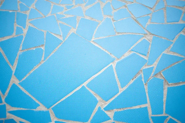 Piedra de roca azulejo de decoración de simetría pintado azul con grietas textura de fondo de pared — Foto de Stock