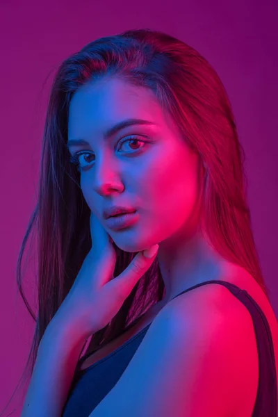 Portrait of a girl, model shot in the studio with color filters. Portrait, fashion, beauty, glow. — Stock Photo, Image