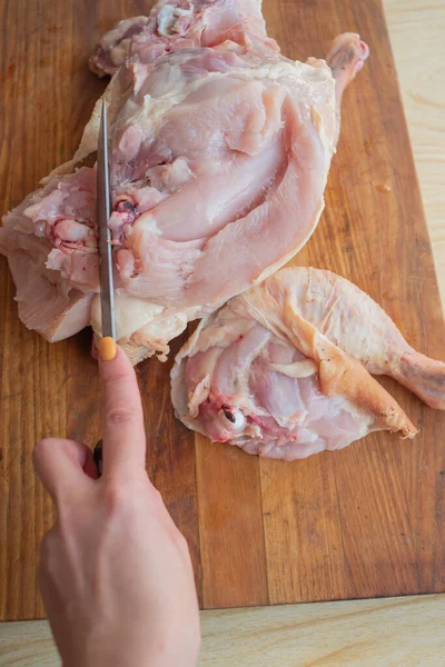 Organic raw whole chicken on wooden rustic background — Stock Photo, Image