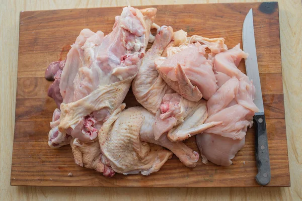 Organic raw whole chicken on wooden rustic background — Stock Photo, Image