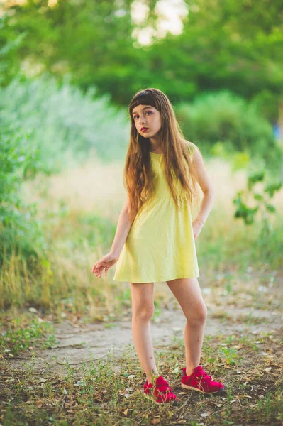 Girl walks in the woods