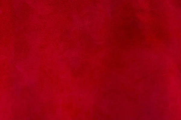スエード生地の赤いマットの背景 クローズアップ シームレスなワインレザーのベルベットの質感 材料マクロを感じます 赤の質感 — ストック写真
