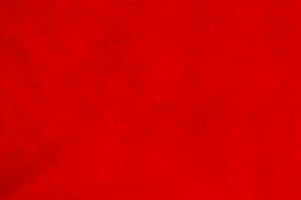 スエード生地の濃い赤マットの背景 クローズアップ シームレスなワインレザーのベルベットの質感 材料マクロを感じます 赤の質感 — ストック写真