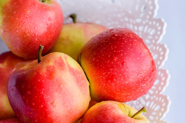 apples in a basket on white background. Apples in a white basket