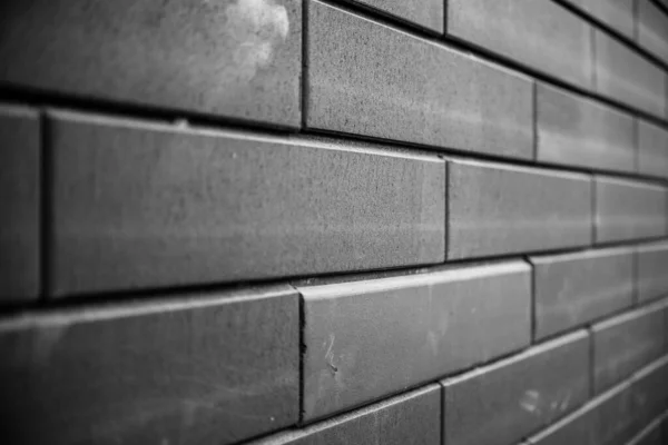 黒レンガの壁 都市の黒レンガの壁のテクスチャの石積みの背景 — ストック写真