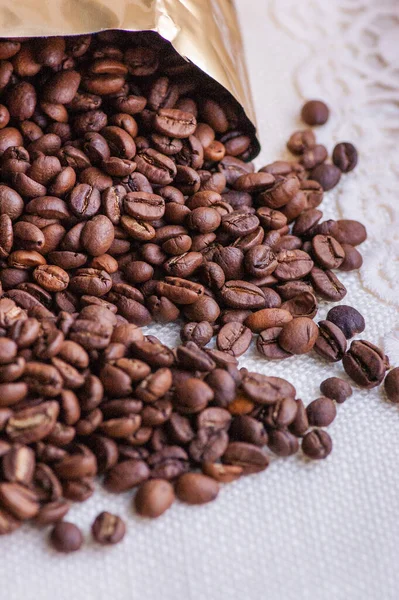 Coffee beans background. Light roasted natural coffee beans. Morning and vigor, caffeine. Arabica