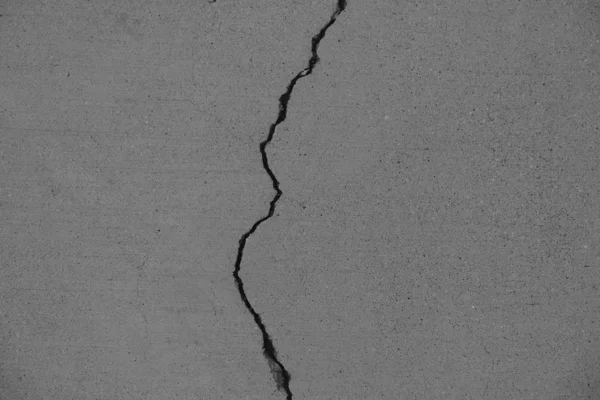 Crack in concrete on the streets of Los Angeles. Background for interior design.