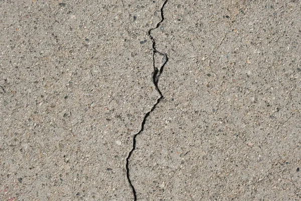 Crack in concrete on the streets of Los Angeles. Background for interior design.