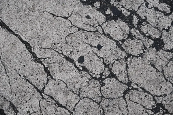 Crack in concrete on the streets of Los Angeles. Background for interior design.