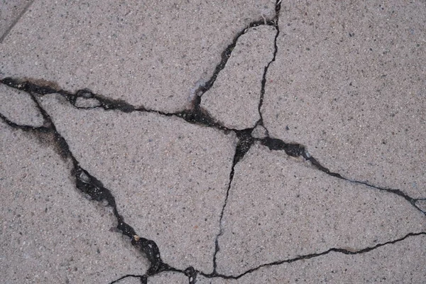 Crack in concrete on the streets of Los Angeles. Background for interior design.