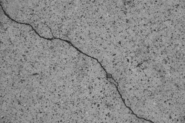 Crack in concrete on the streets of Los Angeles. Background for interior design.