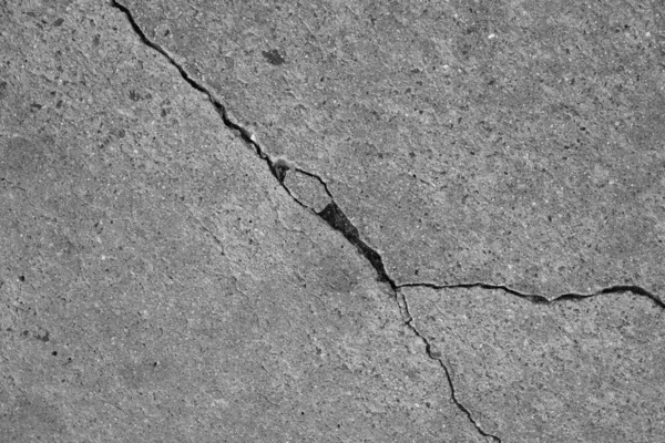 Crack in concrete on the streets of Los Angeles. Background for interior design.