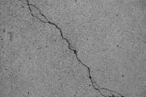 Crack in concrete on the streets of Los Angeles. Background for interior design.