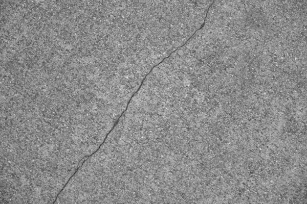 Crack in concrete on the streets of Los Angeles. Background for interior design.