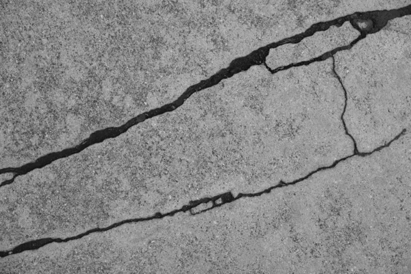 Crack in concrete on the streets of Los Angeles. Background for interior design.