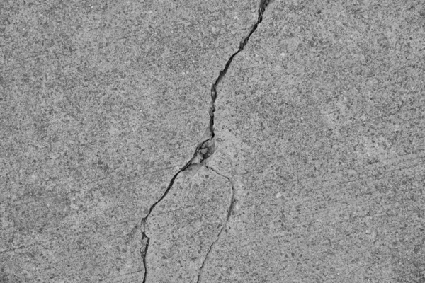 Crack in concrete on the streets of Los Angeles. Background for interior design.