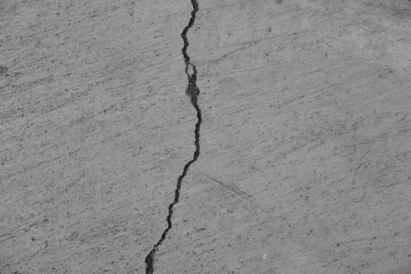 Crack in concrete on the streets of Los Angeles. Background for interior design.