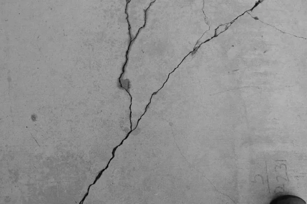 Crack in concrete on the streets of Los Angeles. Background for interior design.