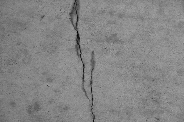 Crack in concrete on the streets of Los Angeles. Background for interior design.