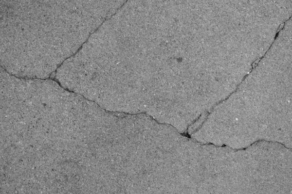 Crack in concrete on the streets of Los Angeles. Background for interior design.